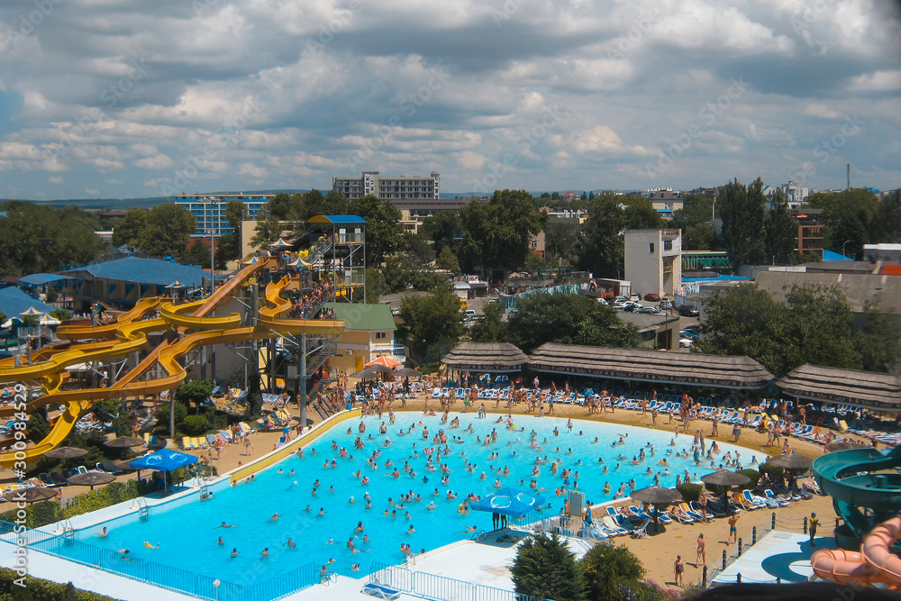 View of the pool in the water park from a height. bird flight. It's a nasty day. Summer holiday concept