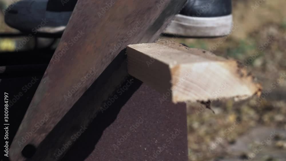 closeup man saws firewood hand saw. male hand sawing old wood. 4k video. 59.94 fps closeup man saws firewood hand saw. male hand sawing old wood. 4k video. 59.94 fps