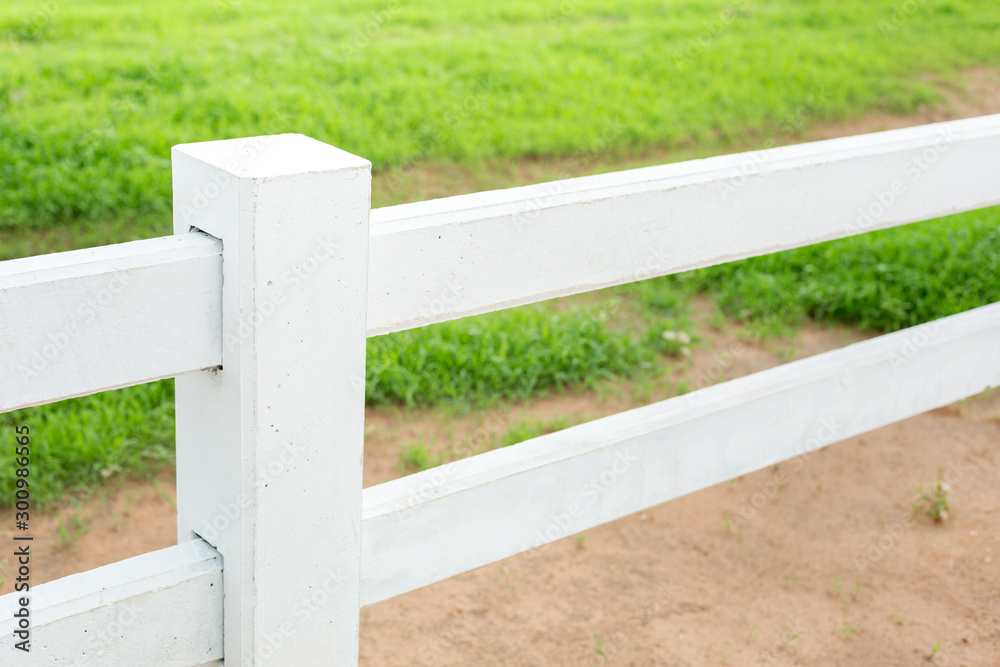 White concrete fence in farm field White concrete fence in farm field
