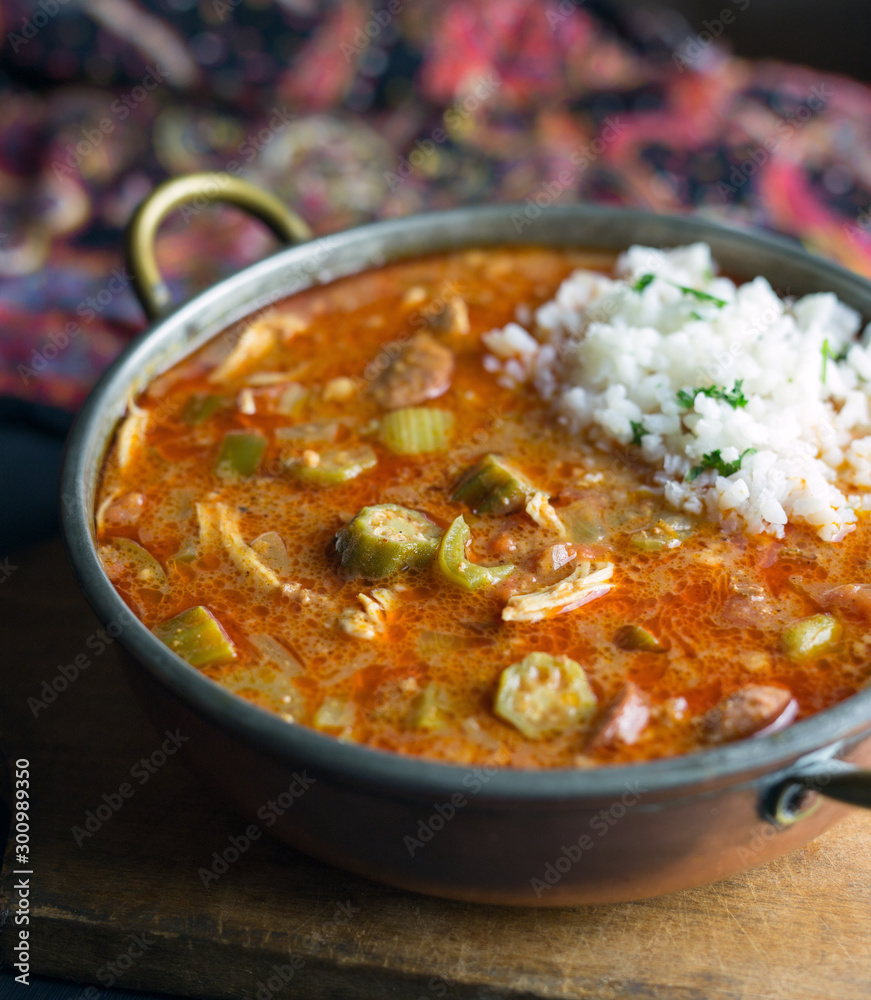 Close up view of chicken gumbo with a scoop of rice. Close up view of chicken gumbo with a scoop of rice.