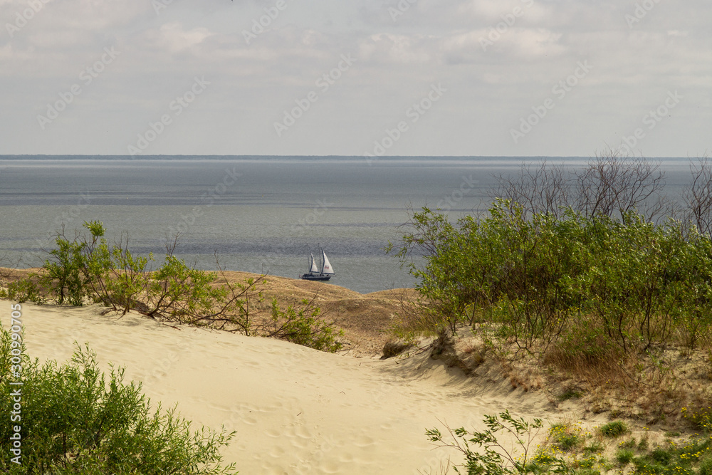 Parnidis dune in Nida. The Curonian Spit. Sand and Grass. People Walking On the Sand Dunes Images. Baltic Sea Parnidis dune in Nida. The Curonian Spit. Sand and Grass. People Walking On the Sand Dunes Images. Baltic Sea