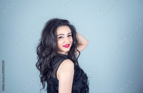 Portrait of beautiful young woman black dress with perfect smile