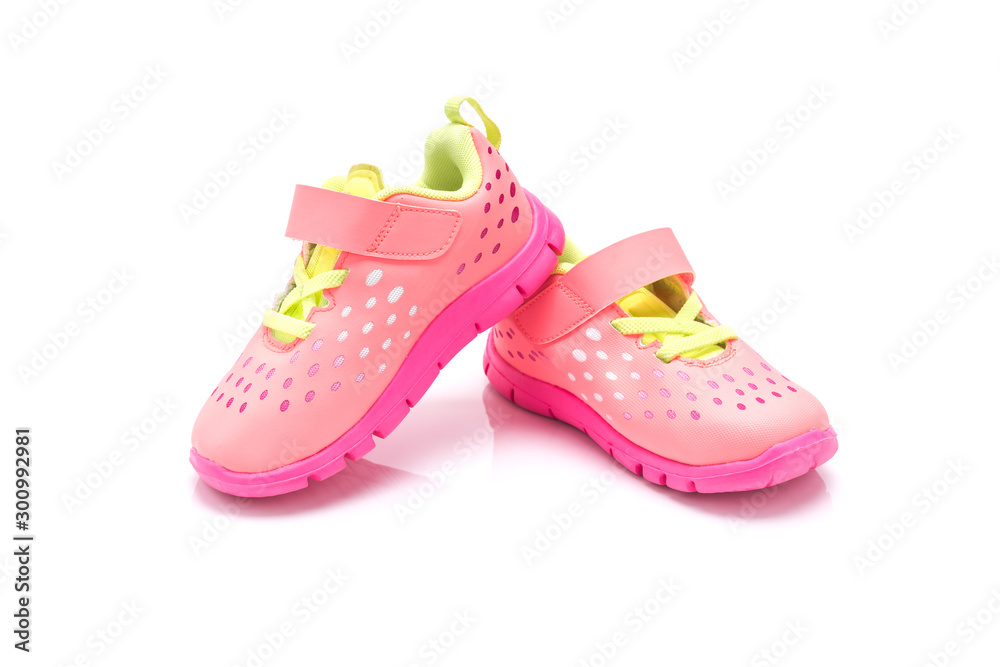 Cute pink baby girl sneakers isolated on white background Cute pink baby girl sneakers isolated on white background