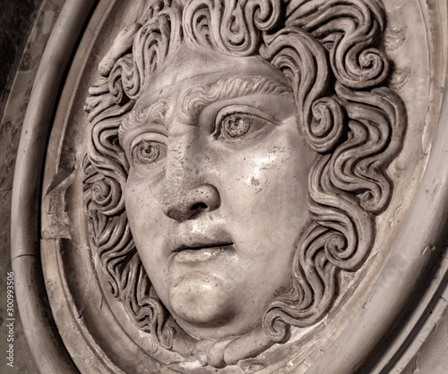 Medusa face sculpture. Head portrait of MedusaIn Greek mythology Medusa was a monster, a Gorgon, a winged human female with a hideous face and living venomous snakes in place of hair