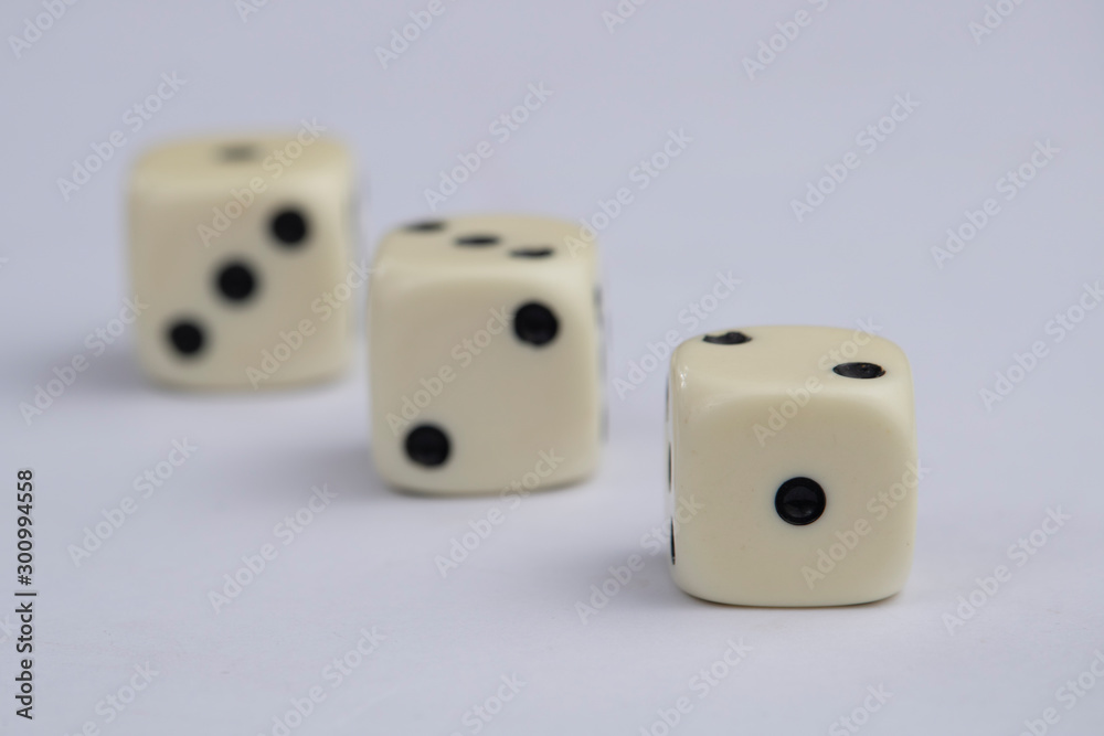 White dice with black dots in white background White dice with black dots in white background