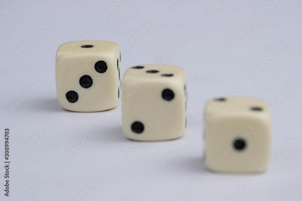 White dice with black dots in white background White dice with black dots in white background