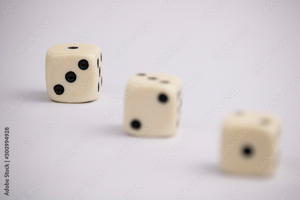 White dice with black dots in white background White dice with black dots in white background