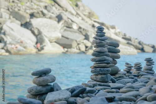 Fototapeta Naklejka Na Ścianę i Meble -  Stones towers raised close to the new beach of Vernazza, Cinque Terre, La Spezia, Italy