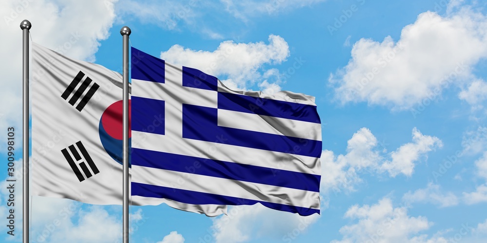 South Korea and Greece flag waving in the wind against white cloudy blue sky together. Diplomacy concept, international relations.