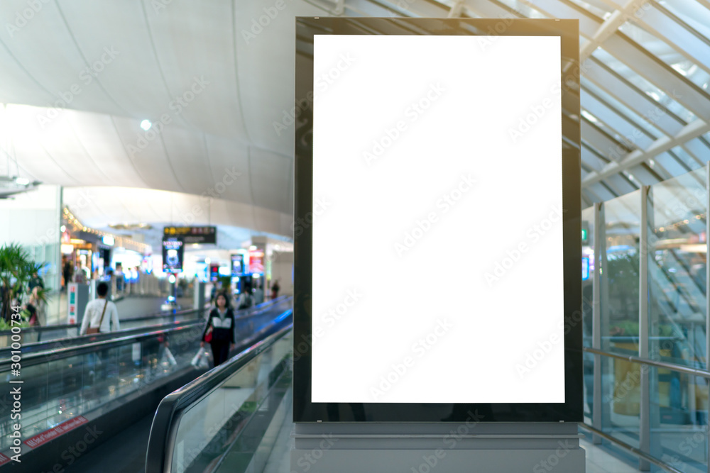 Blank white mock up of vertical light box billboard at the airport