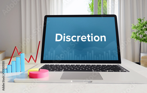 Discretion – Statistics/Business. Laptop in the office with term on the display. Finance/Economics.