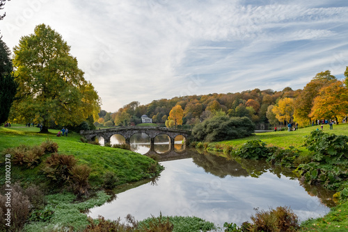 View of the pantheon and the bridge at Stourhead garden in Wiltshire in autumn. photo