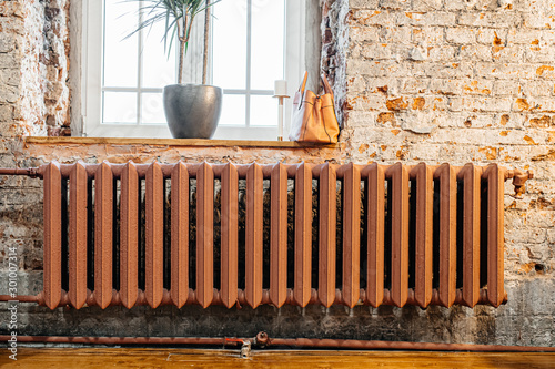 old vintage radiator under the window