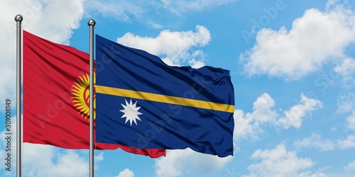 Kyrgyzstan and Nauru flag waving in the wind against white cloudy blue sky together. Diplomacy concept, international relations.