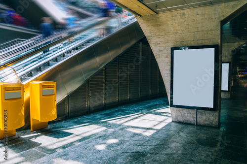 Fototapeta Naklejka Na Ścianę i Meble -  Clear Billboard in public place with blank copy space screen for advertising or promotional poster content, empty mock up Lightbox for information, blank display in station area with daylight