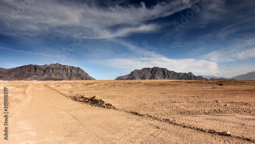 Afghanistan landscape, desert plain against the backdrop of mountains photo