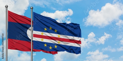 Laos and Cape Verde flag waving in the wind against white cloudy blue sky together. Diplomacy concept, international relations.