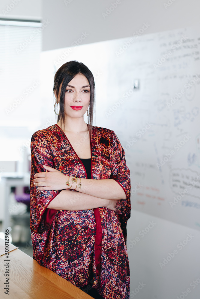 Portrait of beautiful and confident businesswoman standing in new office. . Portrait of beautiful and confident businesswoman standing in new office. .