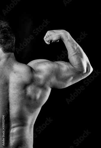 Bodybuilder back muscles flexed