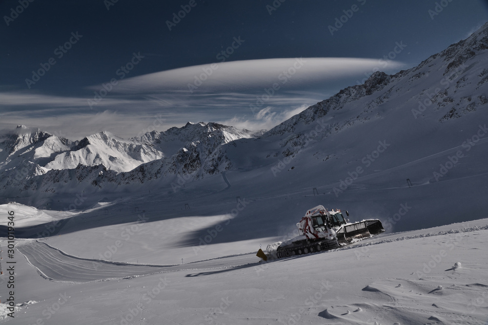 Ski slope preparation in the mountains. Perfect ski slopes. Kaunertal ski resort in Tyrol, Austria, the Alps. Kaunretal glacier. Ski slope preparation in the mountains. Perfect ski slopes. Kaunertal ski resort in Tyrol, Austria, the Alps. Kaunretal glacier.