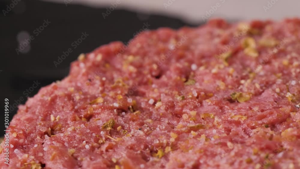 Plant based vegan burger meat, fake vegeterian beef meat close up, fresh impossible veggie food, beyond meat Plant based vegan burger meat, fake vegeterian beef meat close up, fresh impossible veggie food, beyond meat