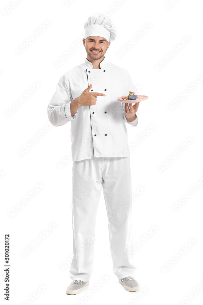Male confectioner with tasty dessert on white background Male confectioner with tasty dessert on white background