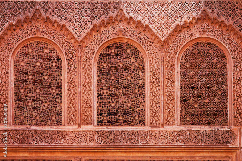 detail of the decorated windows at Ben Youssef Madrasa in Marrakesh, morocco