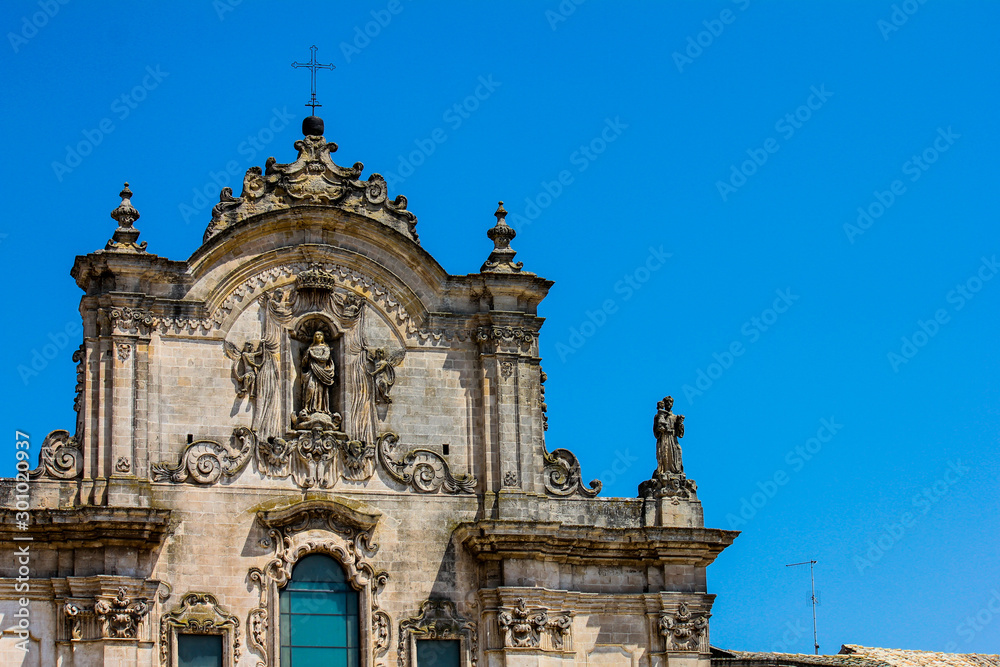 detail of the upper part of the church of St. Francis of Assisi in the city of matera, basilicata, italy