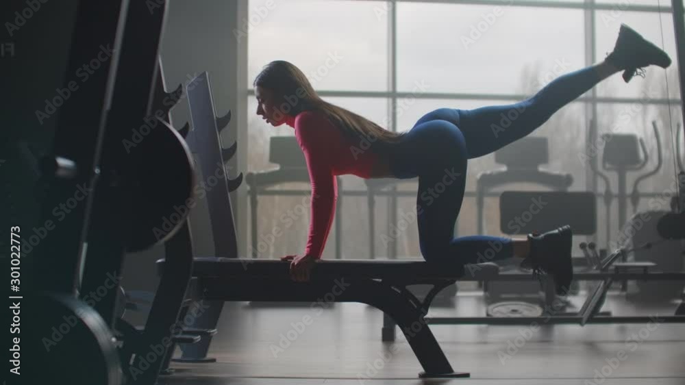 Woman shakes her buttocks in a personal training Woman shakes her buttocks in a personal training