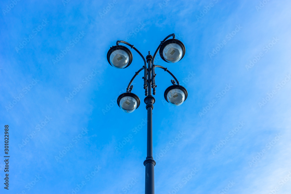 Beautiful street lamp on blue sky background. Beautiful street lamp on blue sky background.