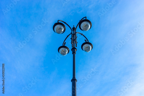 Beautiful street lamp on blue sky background.