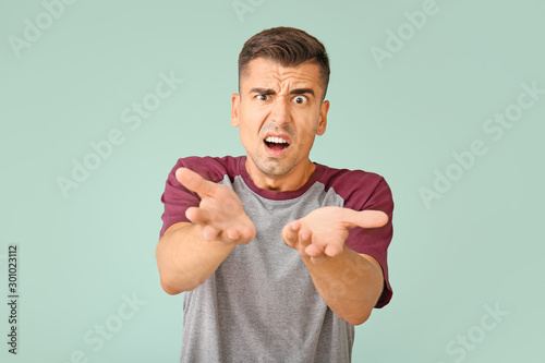 Displeased young man on col...