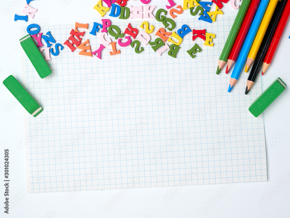 blank white sheet of squared papers and school supplies blank white sheet of squared papers and school supplies