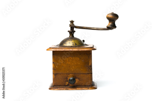 Antique hand-mill for a grinding spices and coffee isolated on whte background