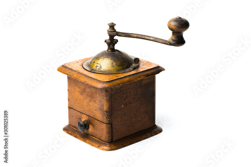 Antique hand-mill for a grinding spices and coffee isolated on whte background