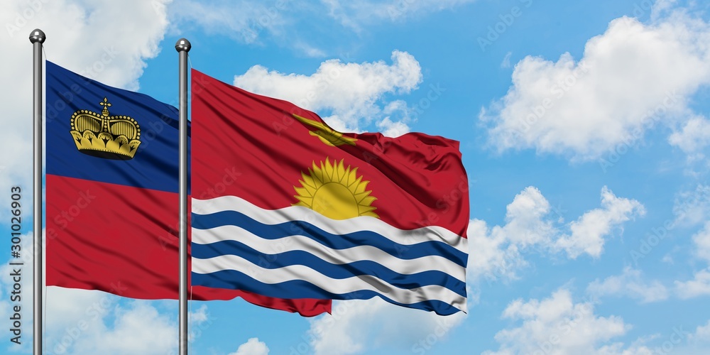 Liechtenstein and Kiribati flag waving in the wind against white cloudy blue sky together. Diplomacy concept, international relations.