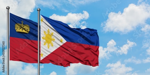 Liechtenstein and Philippines flag waving in the wind against white cloudy blue sky together. Diplomacy concept, international relations.