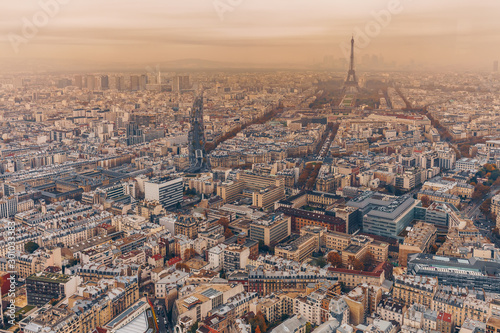 Aerial panorama of Paris City in late autumn from Maine-Montparnasse Tower at sunset.