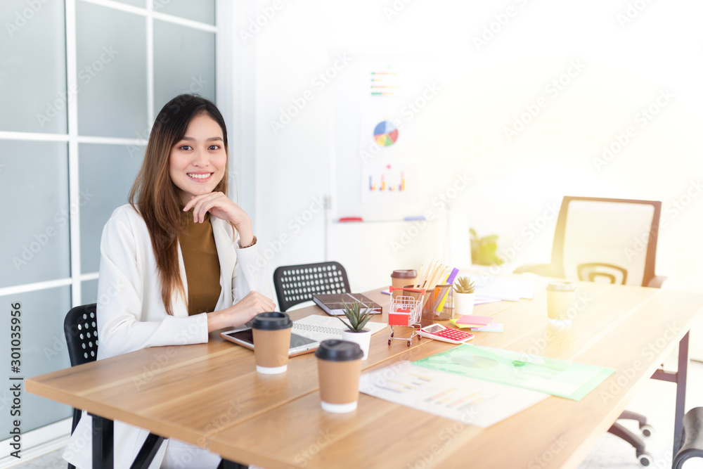 attractive asian officer relax in office, she prepare informaion to conference activity, she rest chin on her hand, she feeling happy and smile, happiness organization attractive asian officer relax in office, she prepare informaion to conference activity, she rest chin on her hand, she feeling happy and smile, happiness organization