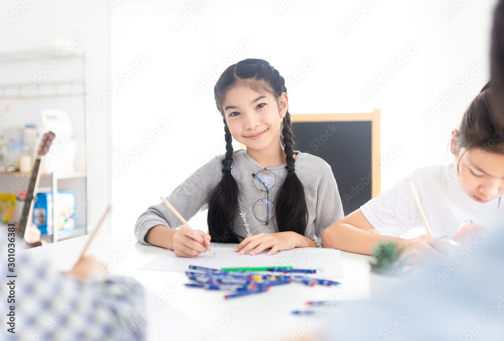 asian children group training to drawing and painting image, they feeling happy and smile, they use pencil and crayon color in art traing time asian children group training to drawing and painting image, they feeling happy and smile, they use pencil and crayon color in art traing time