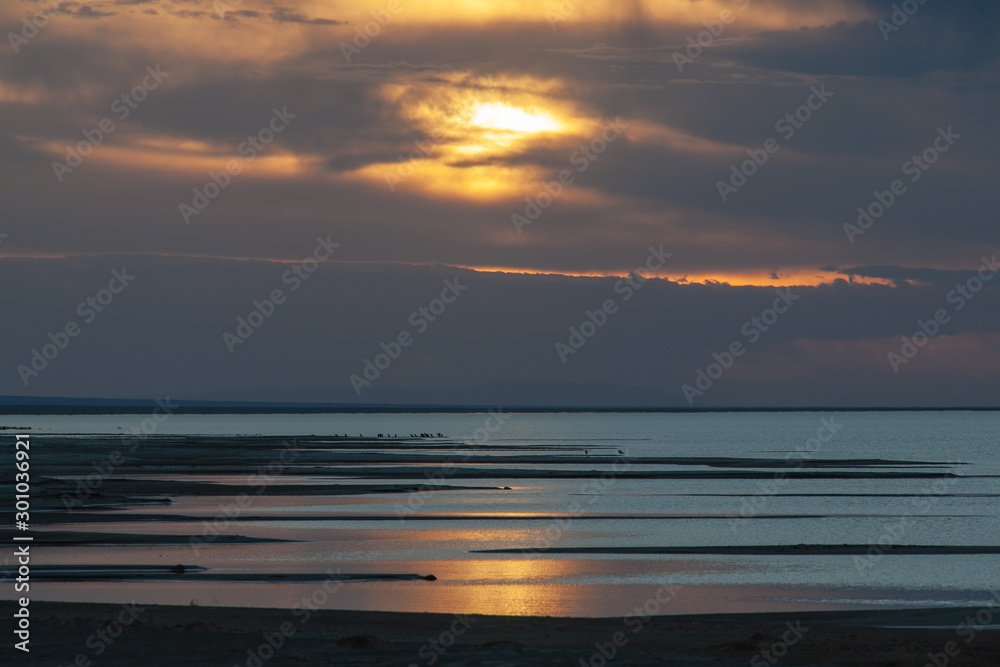 Fototapeta premium Bright sunset on a lake in Mongolia