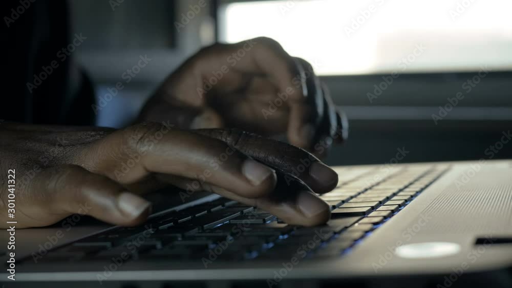 Black business man Working Late At Night Typing,close up