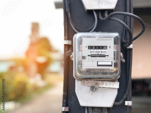 Watthour electricity meter for using in home measure the electricity cost, has copy space, Home technology development with light natural in the morning. selective focus and blurred background.