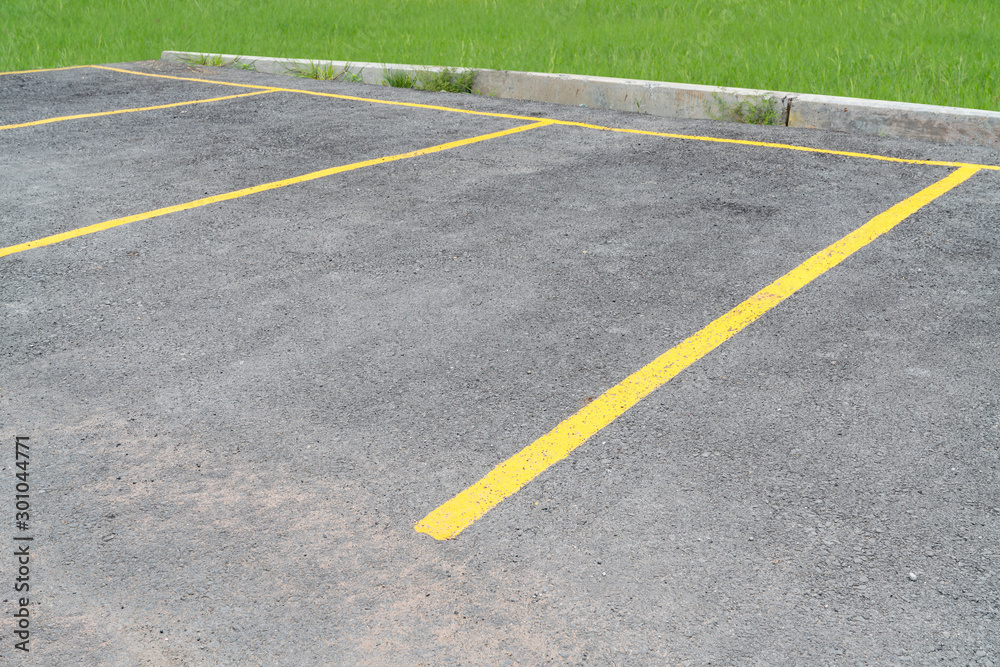 yellow lines parking on asphalt background