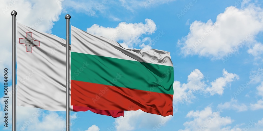 Malta and Bulgaria flag waving in the wind against white cloudy blue sky together. Diplomacy concept, international relations.