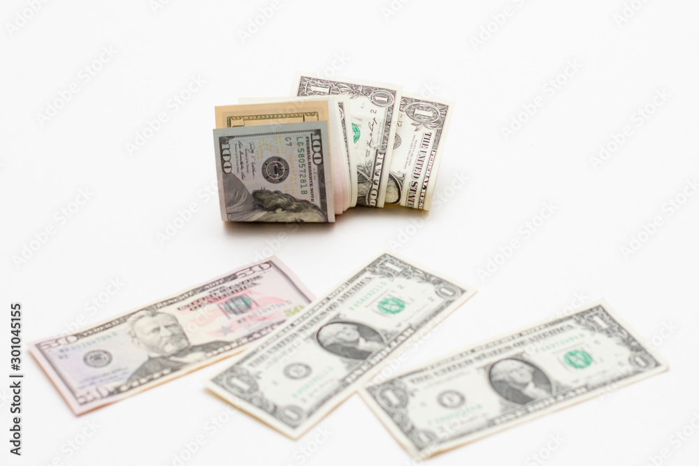 Dollar bills of different denominations on a white background. Paper money american dollars Dollar bills of different denominations on a white background. Paper money american dollars