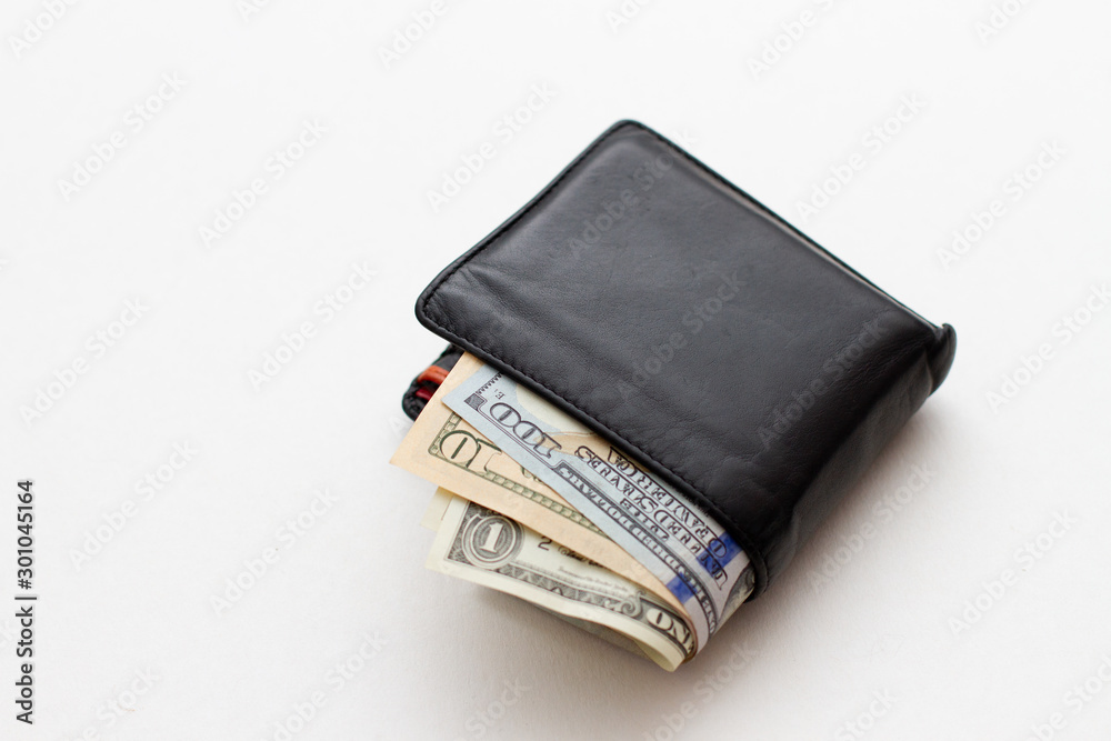 Full wallet of money. American dollars in wallet Full wallet of money. American dollars in wallet