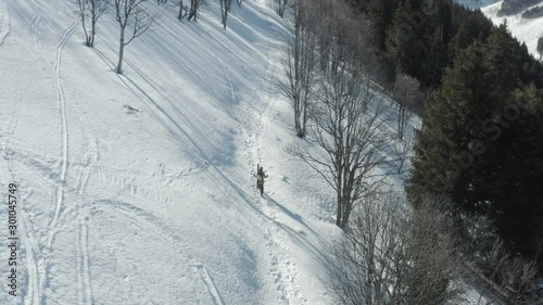 Skier Walking to the Top of Mountain with Skiing on Back, by Drone 10