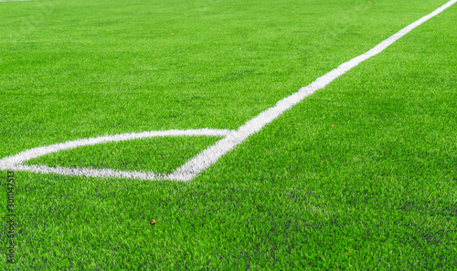 White line of  Artificial grass soccer field corner soccer field.It made to look like natural grass. It is most often used in arenas for sports that were originally or are normally played on grass.