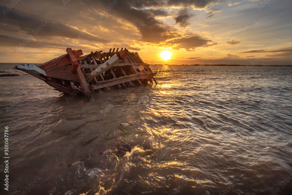Sunset on the beach, Shipwreck.